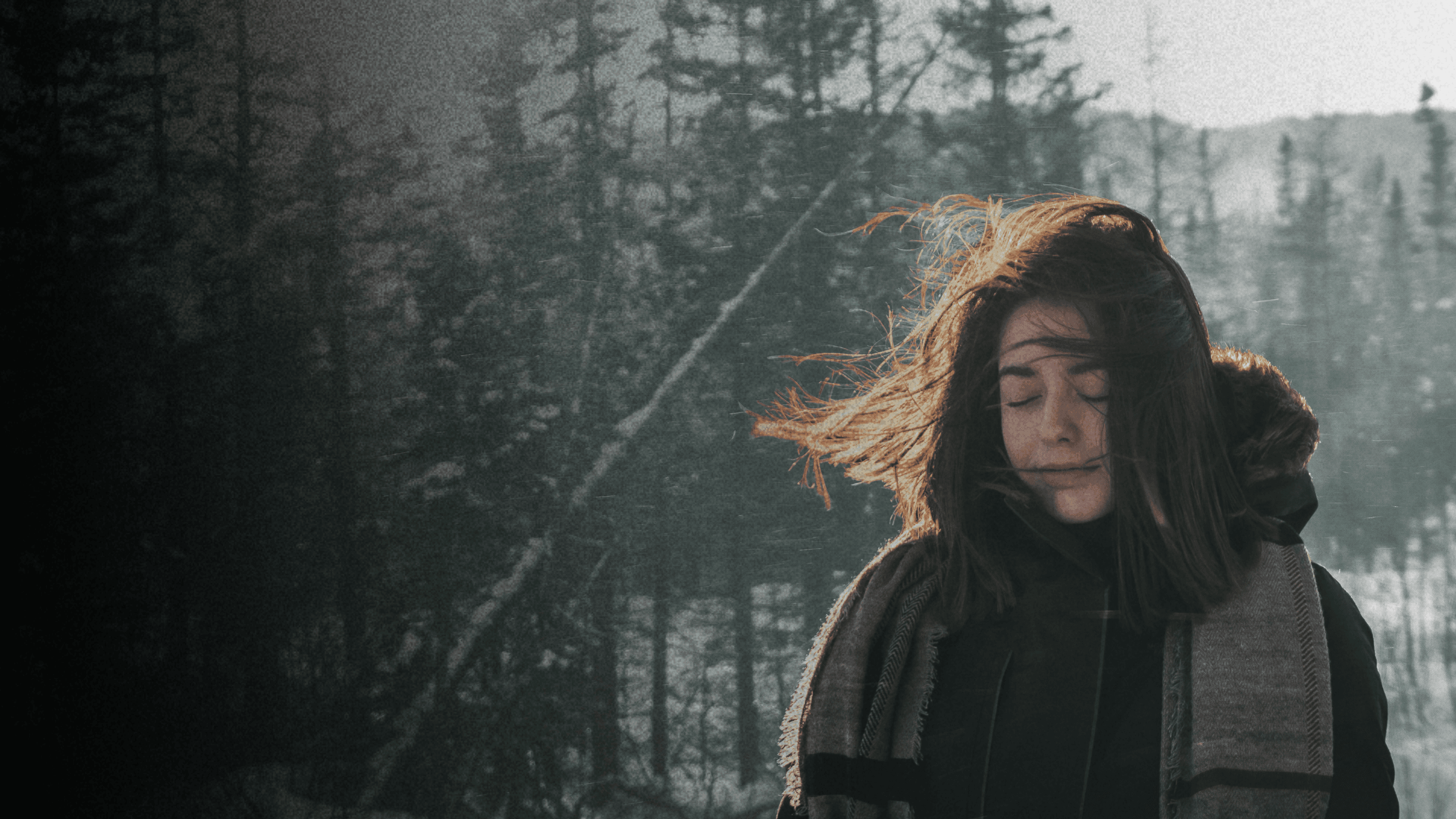 Peaceful woman in nature representing mental wellness and therapy